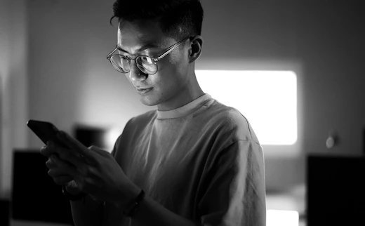 A man on a mobile pohne