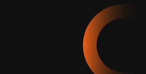 Orange coloured circle on a dark background