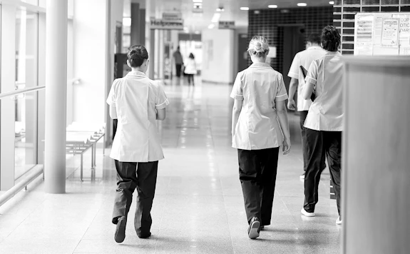 Three nurses walking
