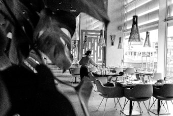 Staff prepare tables at a restaurant