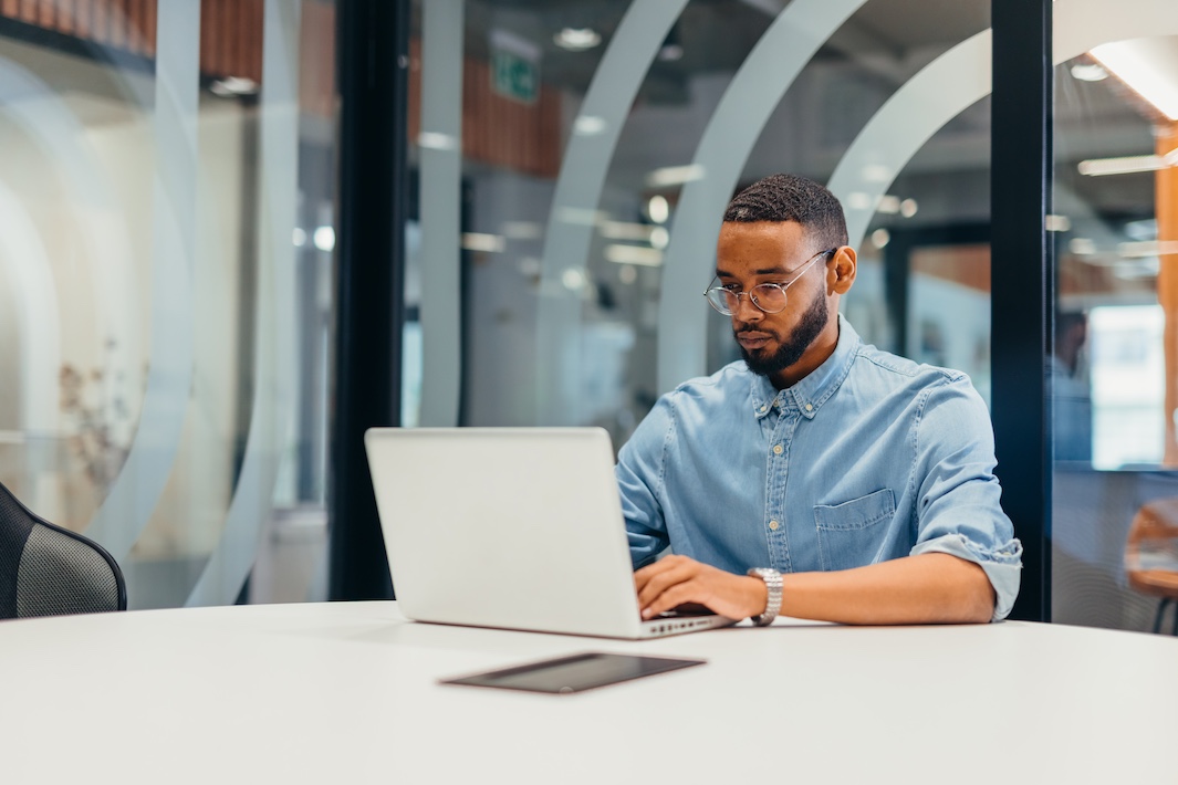 Man at desk with laptop
