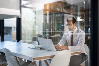 Man working on a laptop in an office