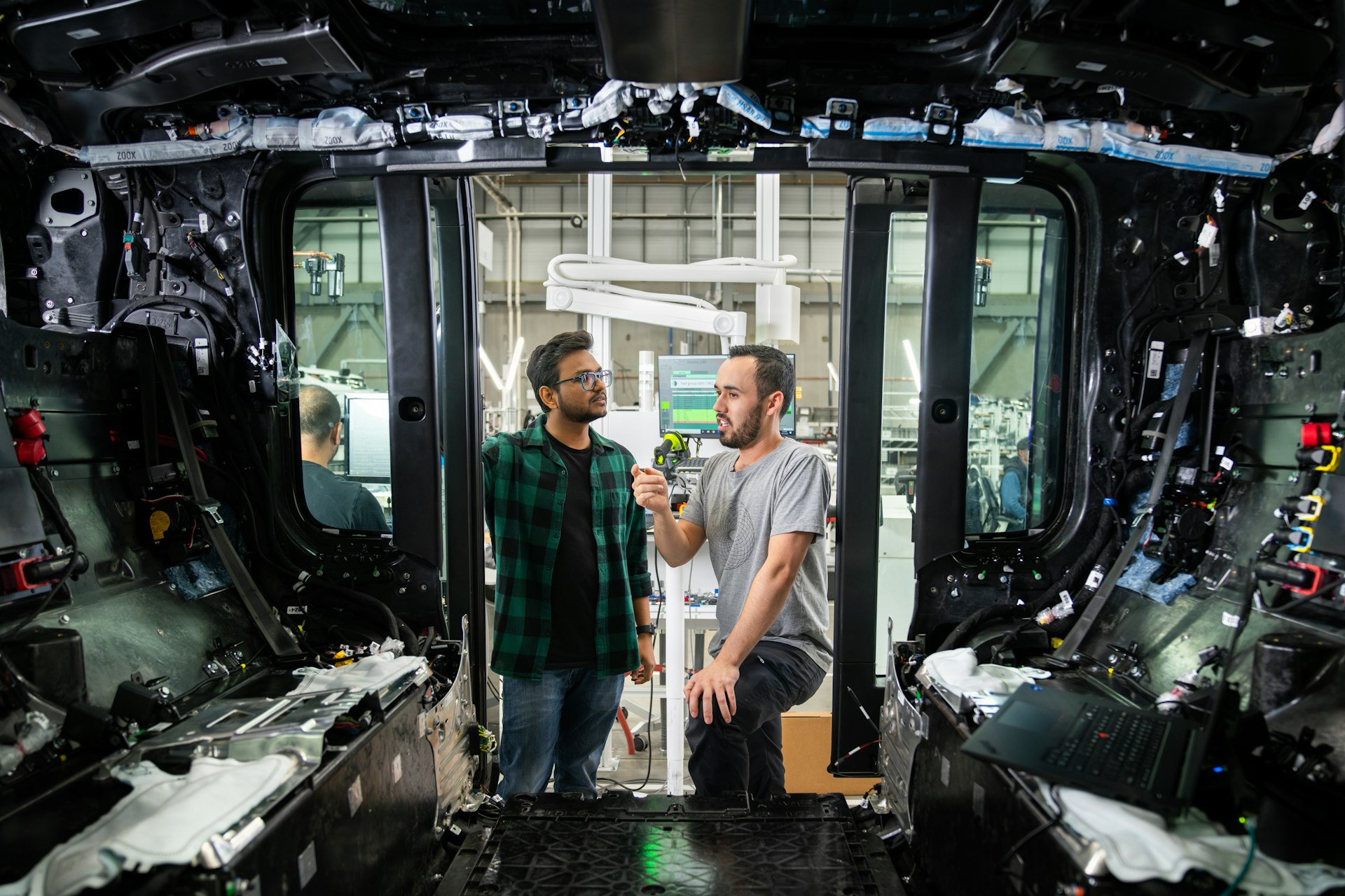 Zoox employees exploring Zoox test vehicle