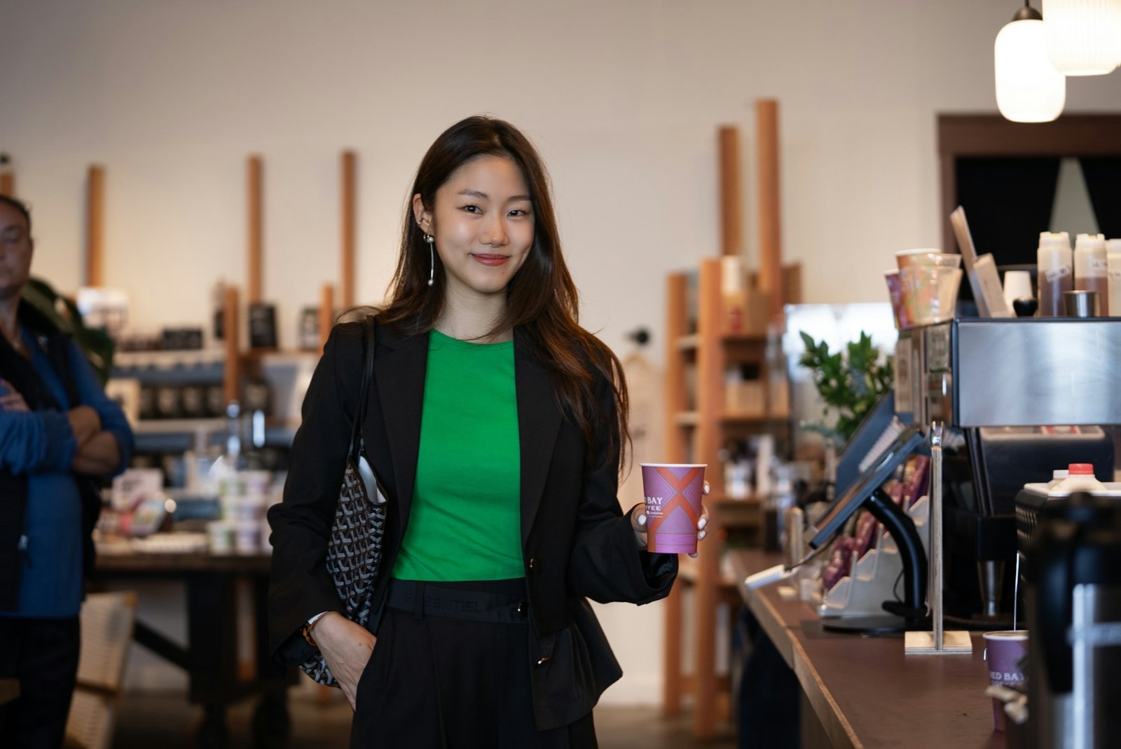 Zoox employee Genie grabbing coffee at a local coffee shop