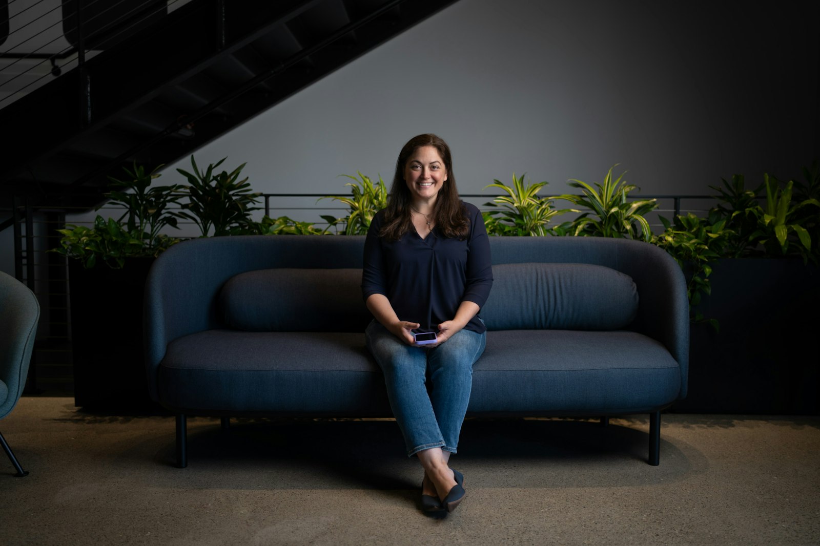 zoox employee lindsay sitting on a couch
