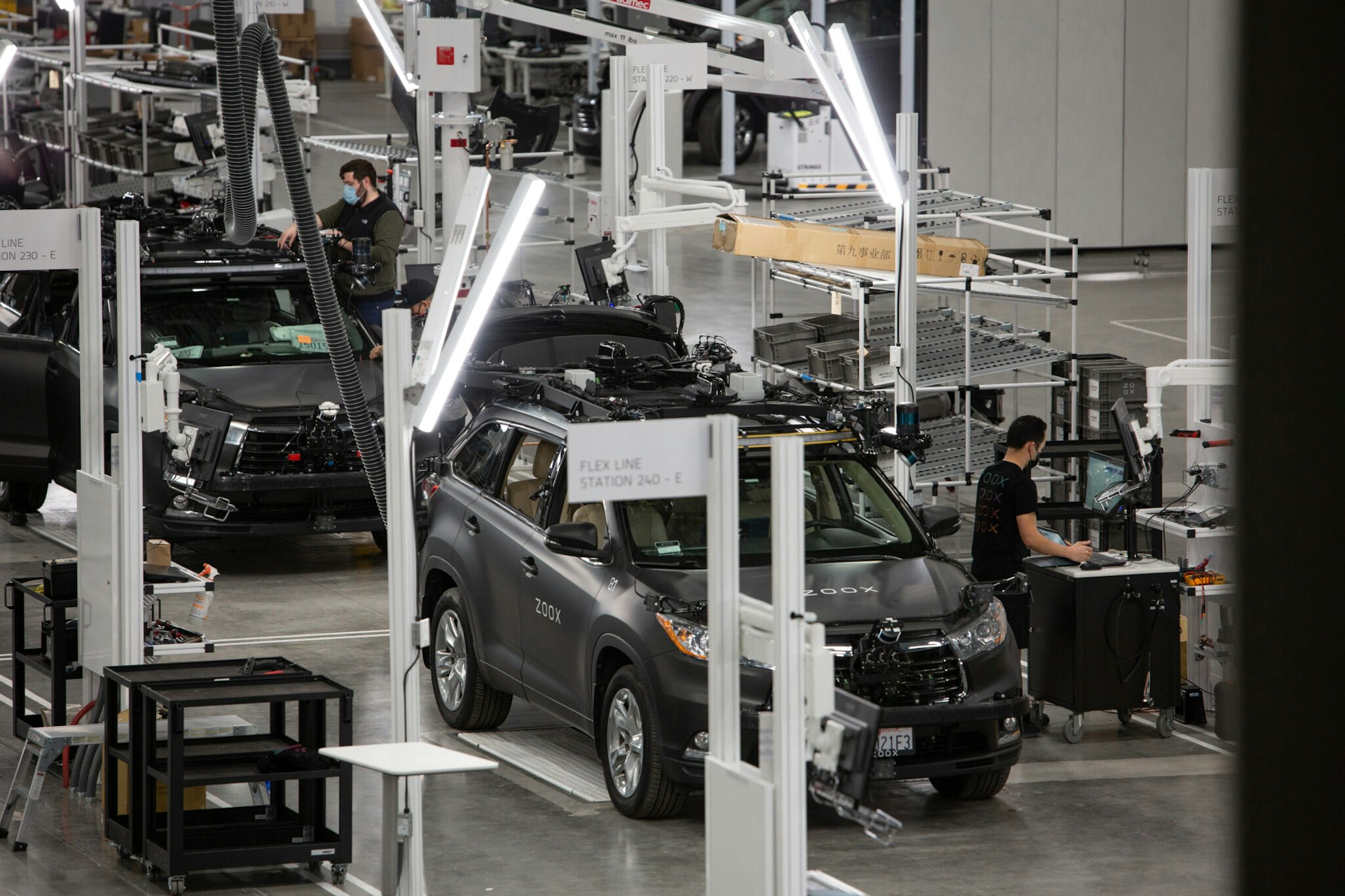 robotaxi assembly line with toyota highlander test vehicles