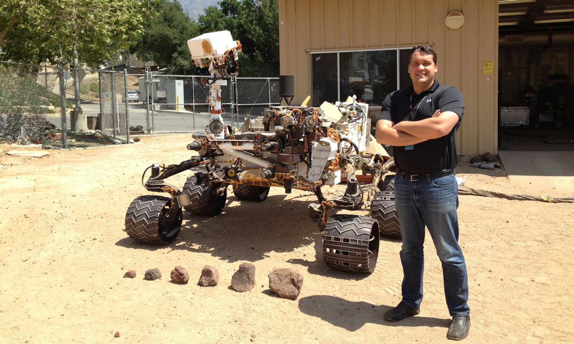 Olivier Toupet standing next to the curiosity rover