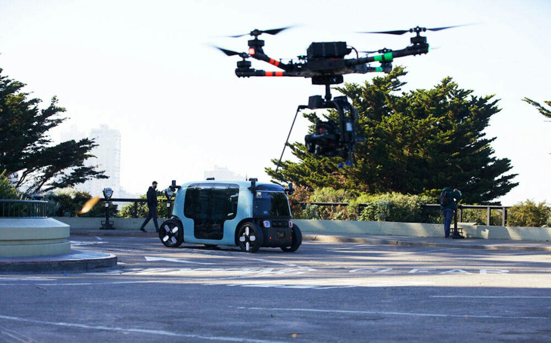 zoox robotaxi in san francisco with a drone