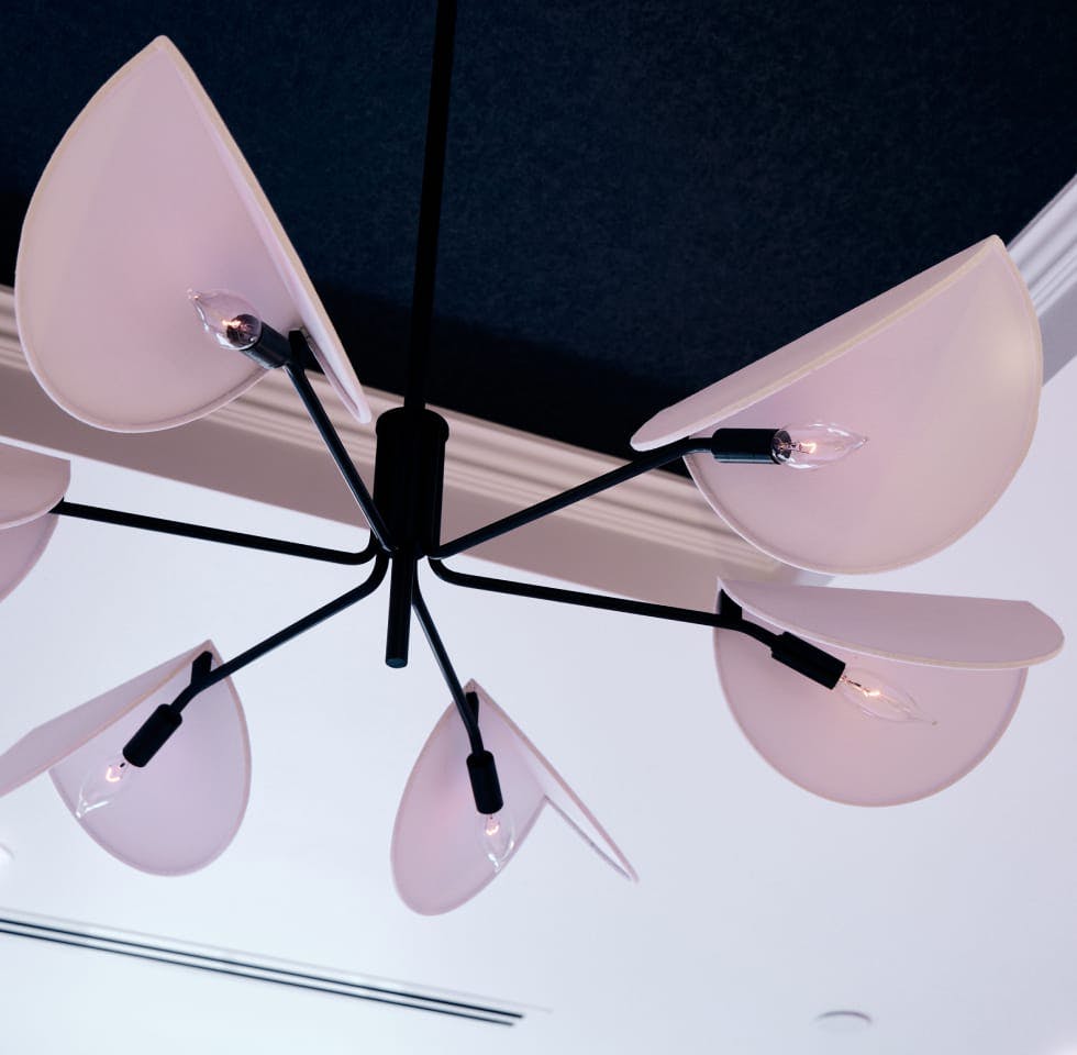 close up of a white and black hanging ceiling light