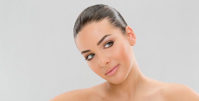 Woman with her hair slicked back in a bun