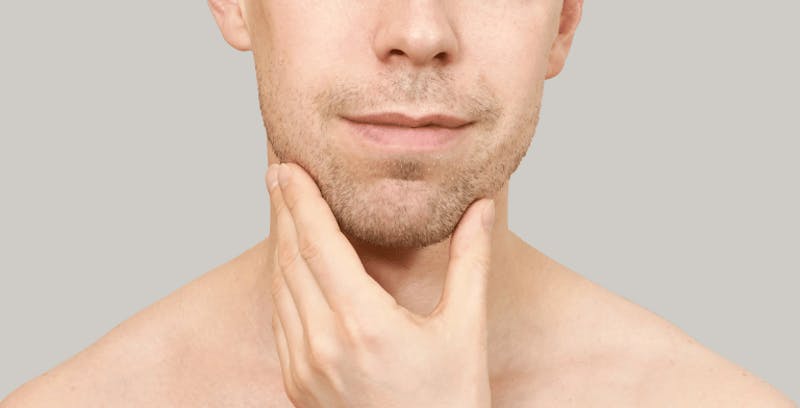 Man touching his chin