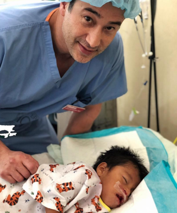 Dr. Leif Rogers with a young patient
