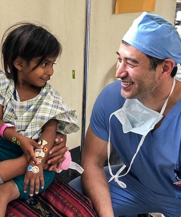 Dr. Leif Rogers with a child patient