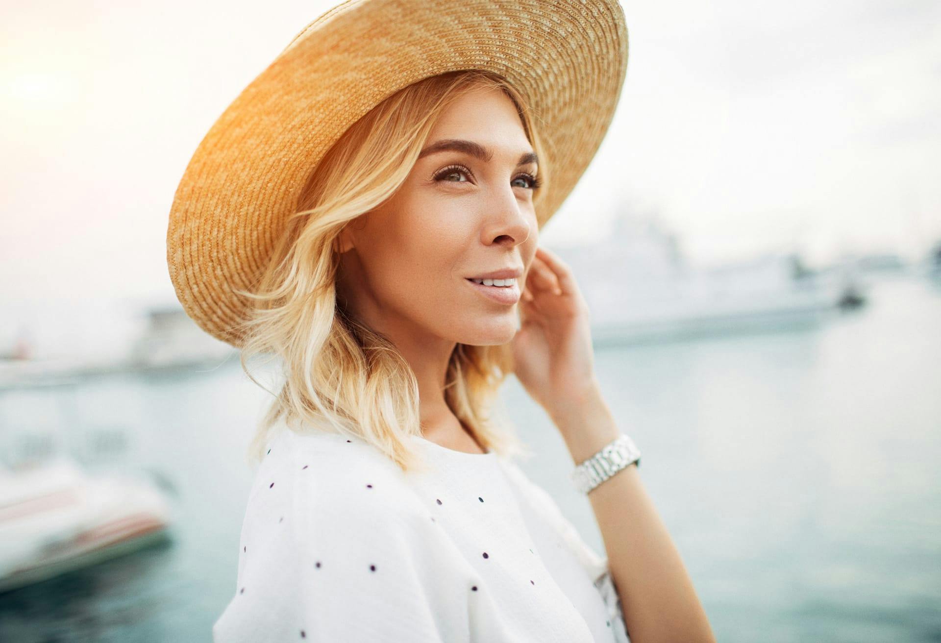 Woman in a sunhat and white top