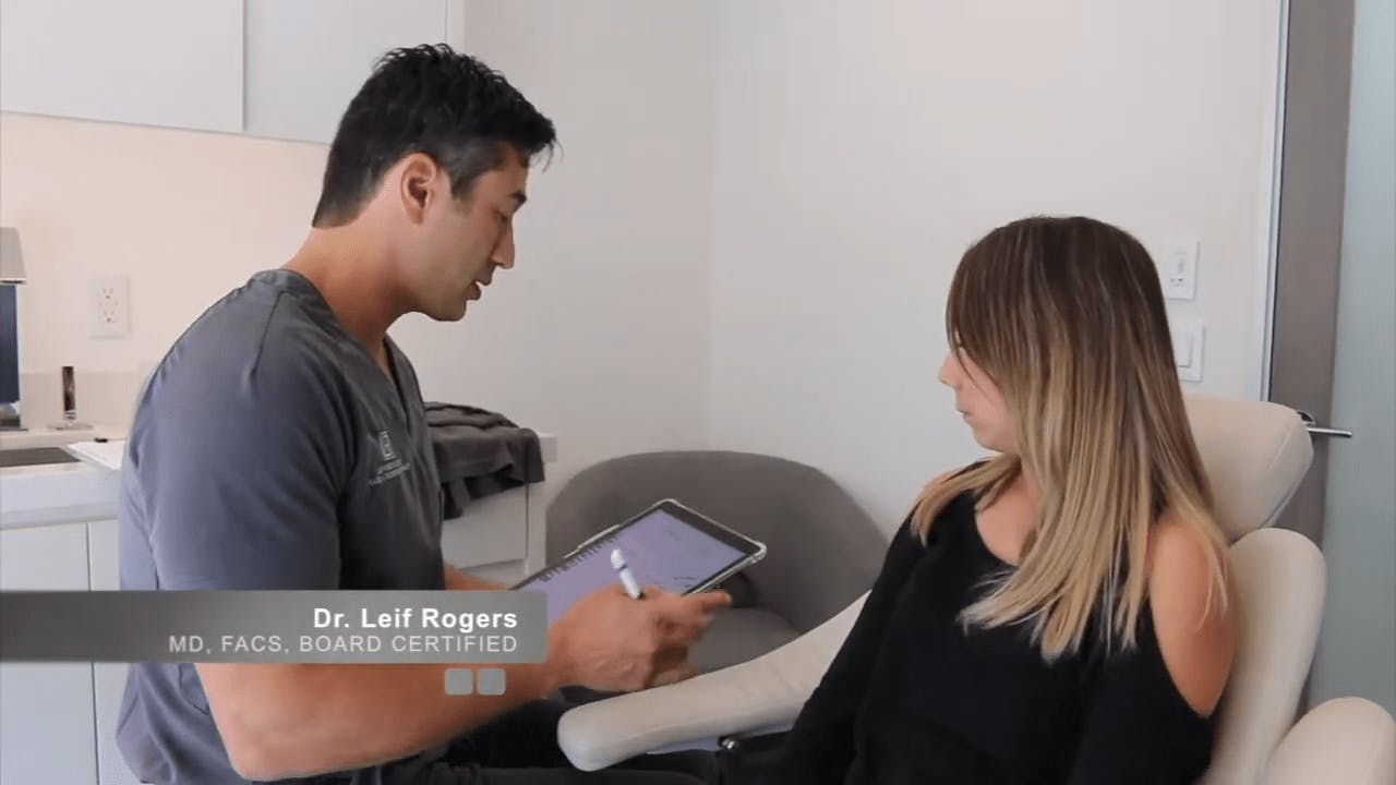 Dr. Leif Rogers with a female patient