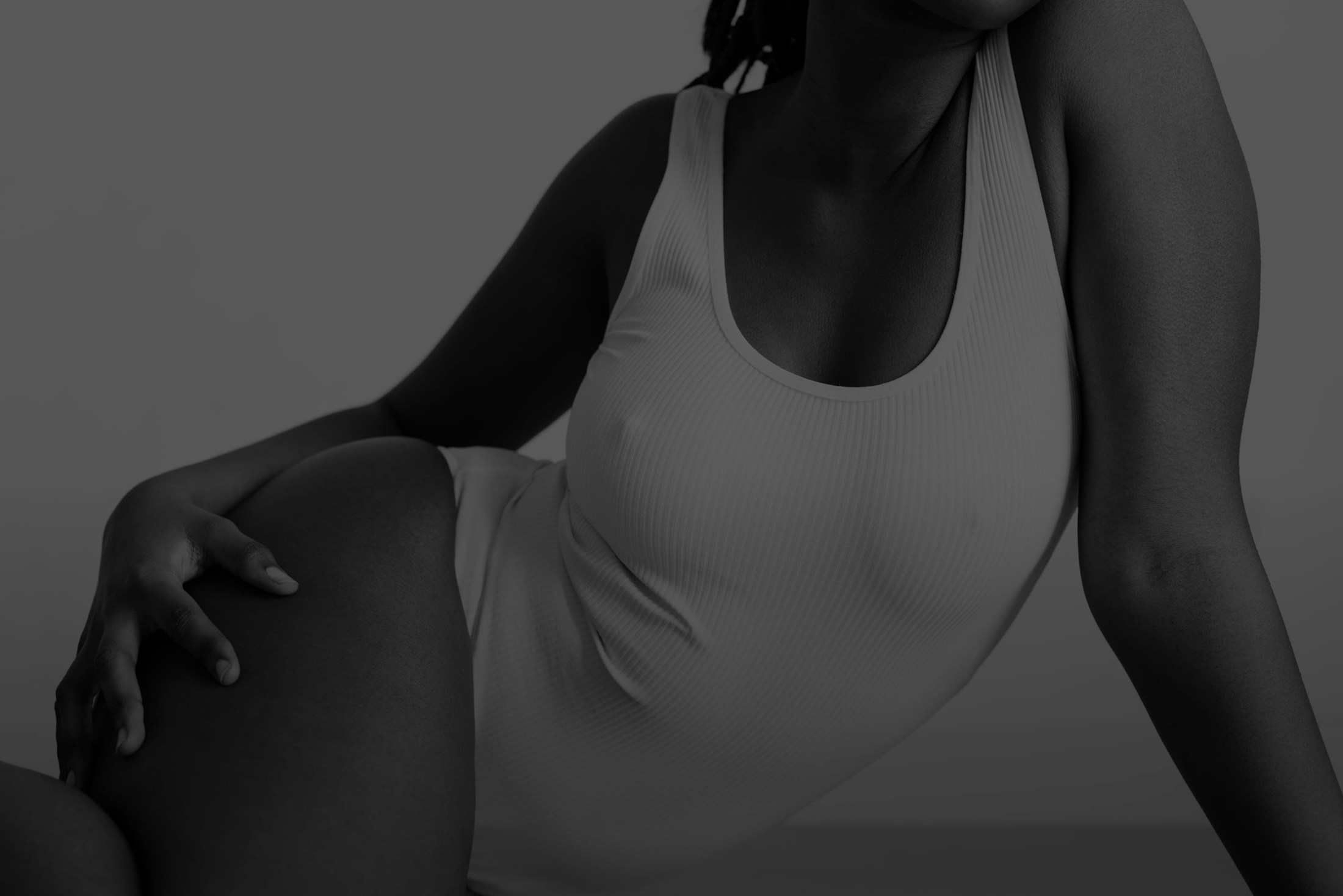 Woman in a white bodysuit