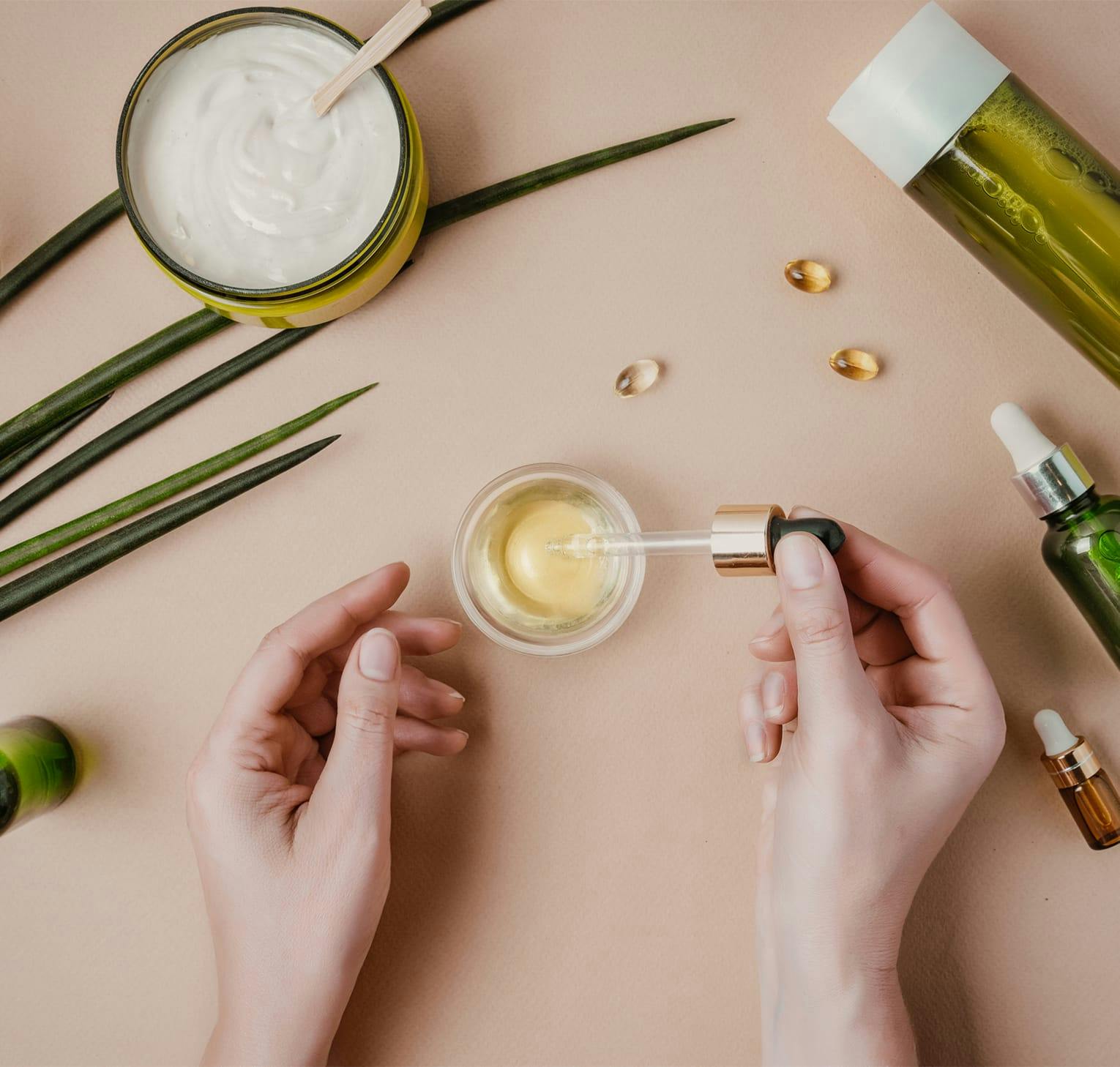 person dripping oil in a cup