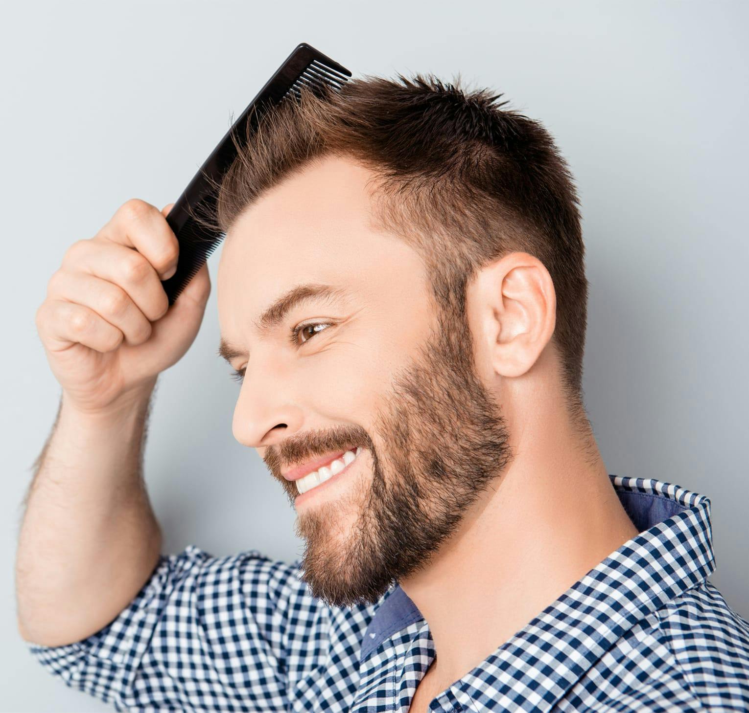 man combing his hair