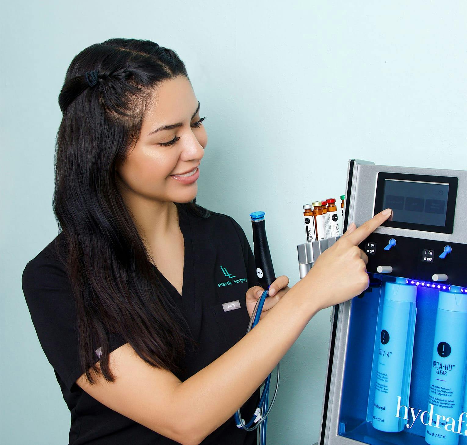 Nurse calibrating a hydrafacial machine