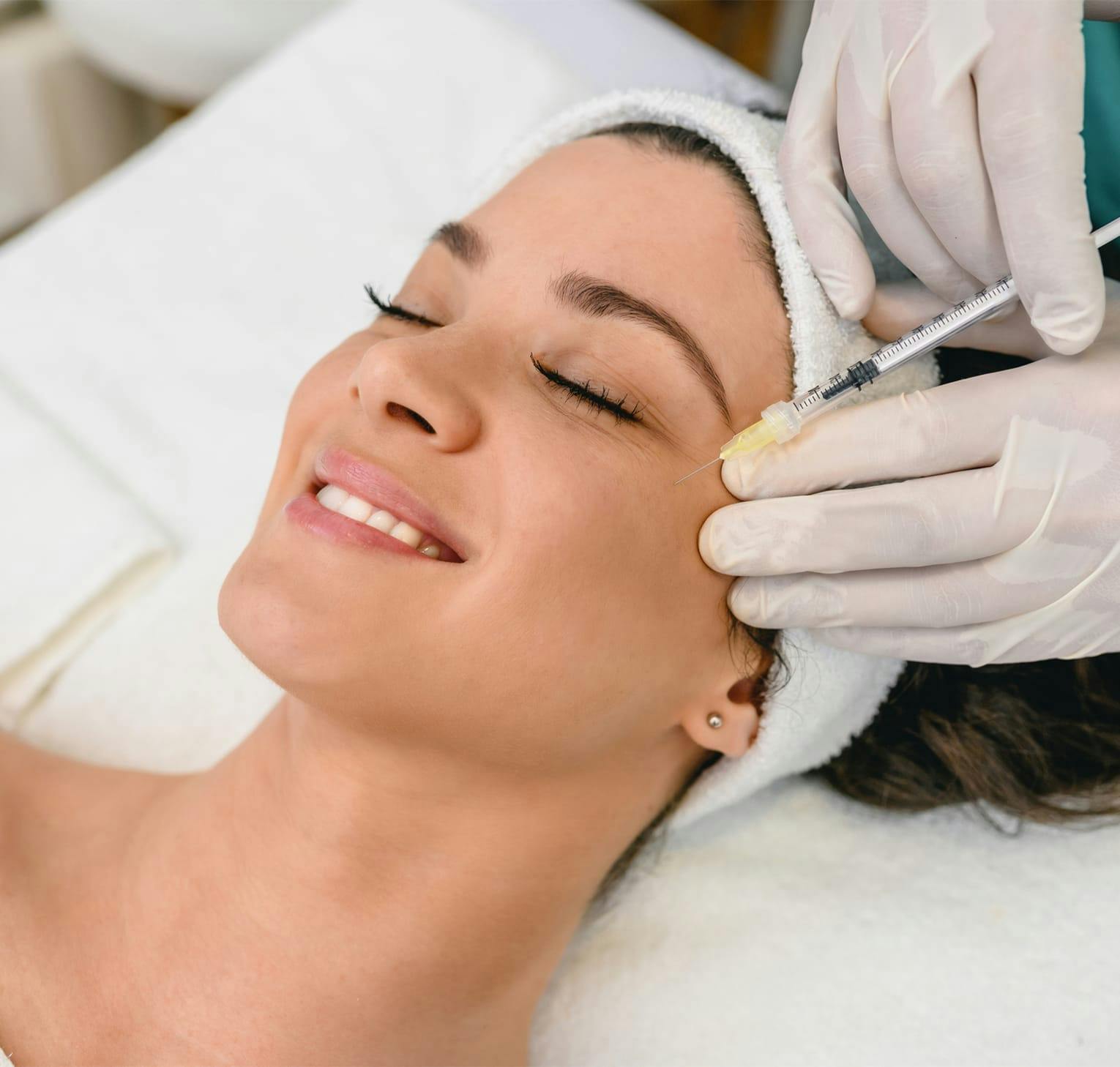 woman getting an injection under her eye