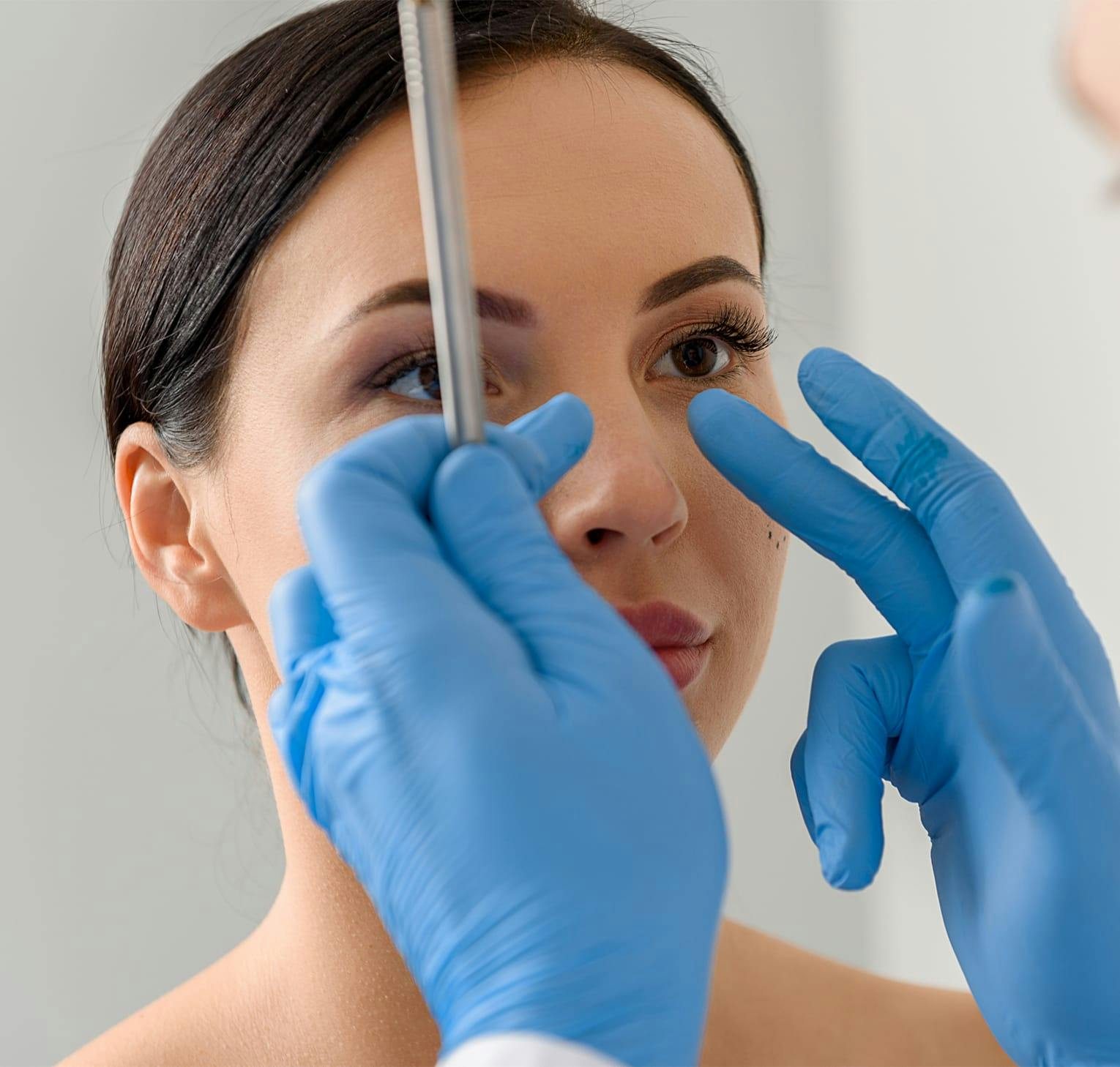 doctor touching patient's nose