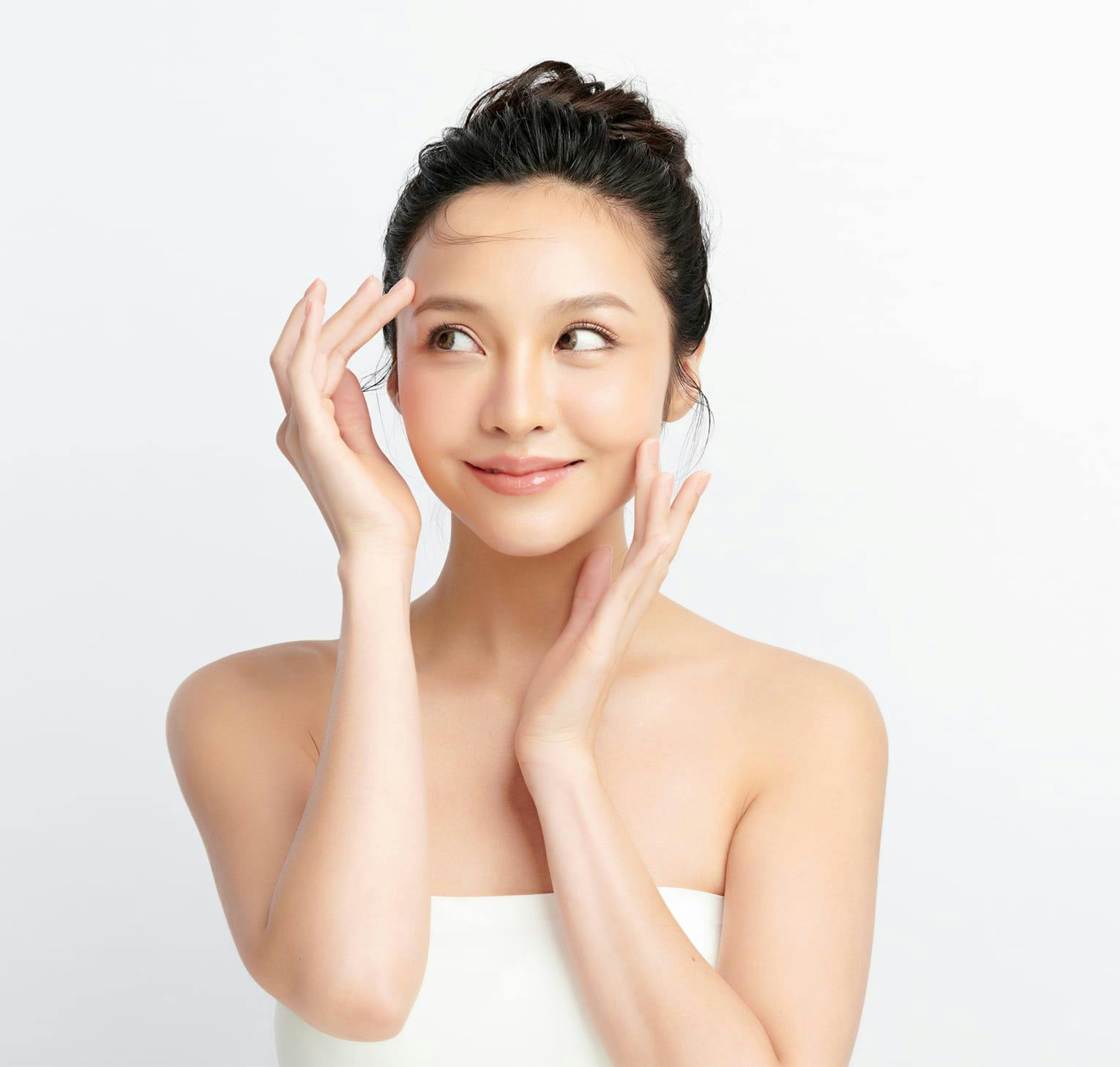 woman touching her face