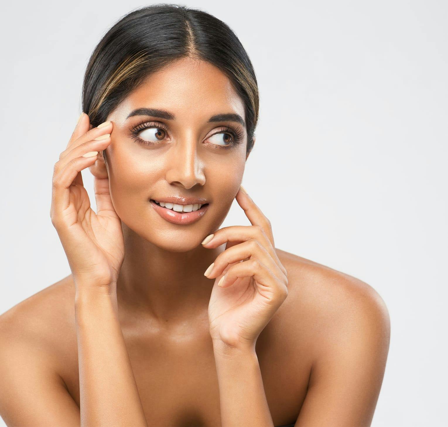 woman with hands by her face