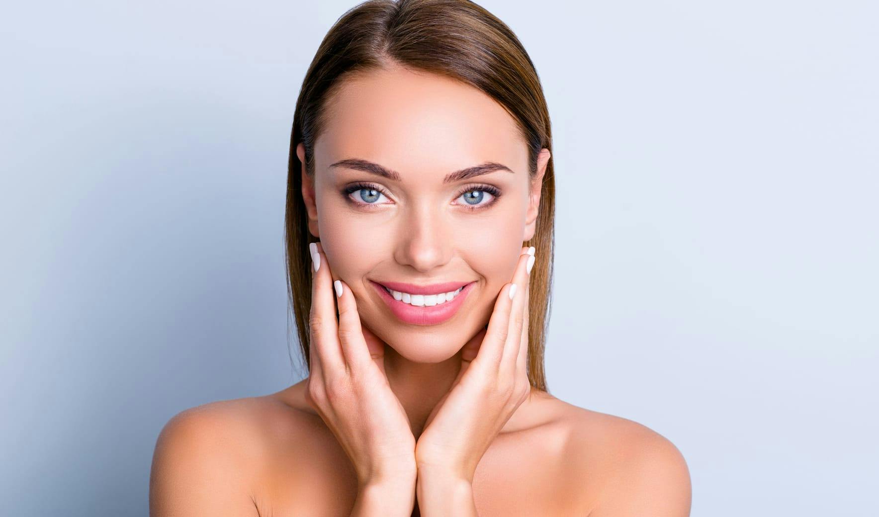 woman cupping her face in her hands