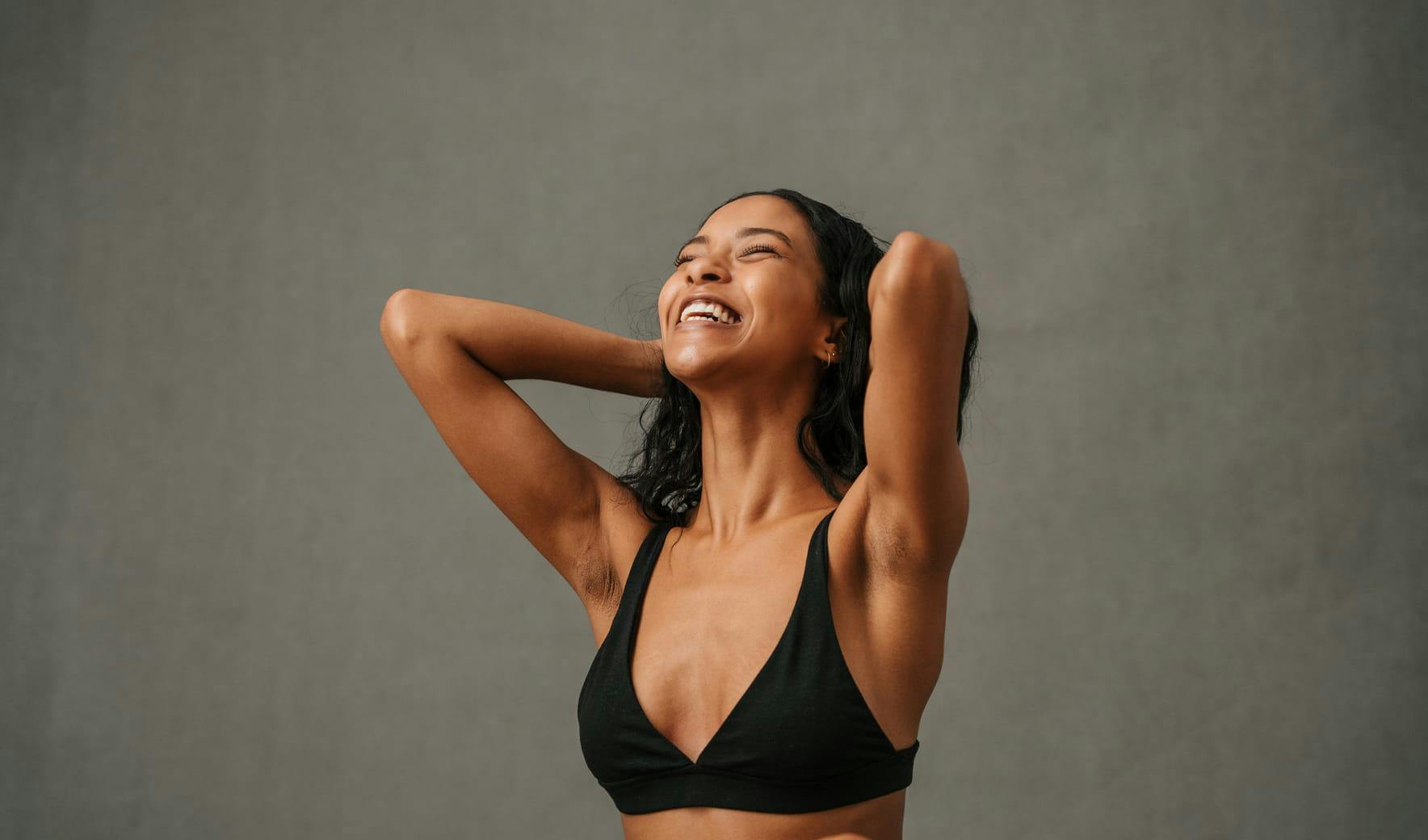 smiling woman in bra