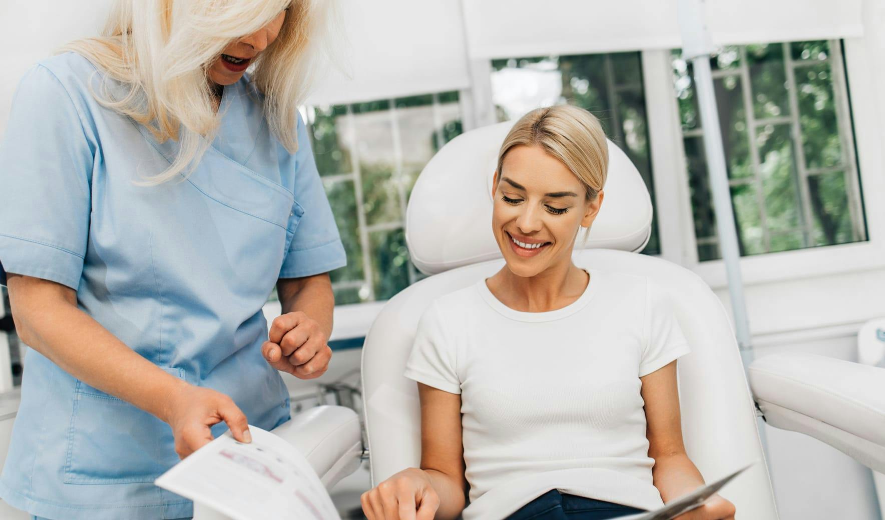 nurse and patient looking at booklet