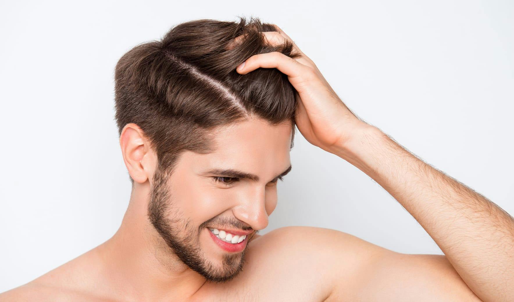 man running his fingers through his hair