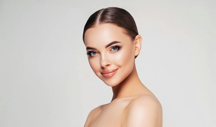 smiling woman with slicked back hair