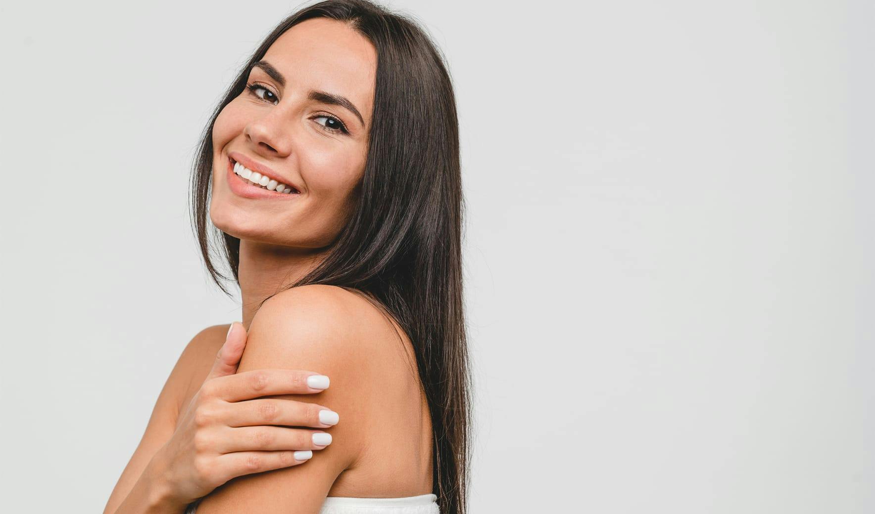 woman with long brown hair smiling