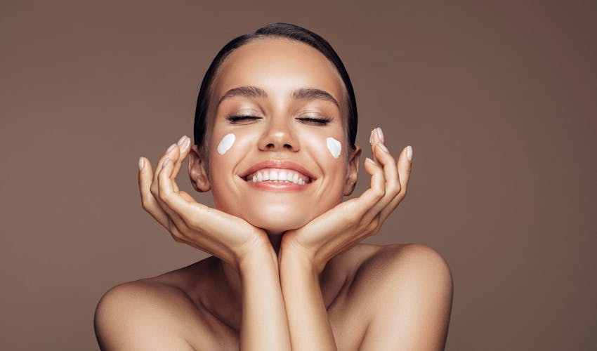 woman cupping her face in her hands