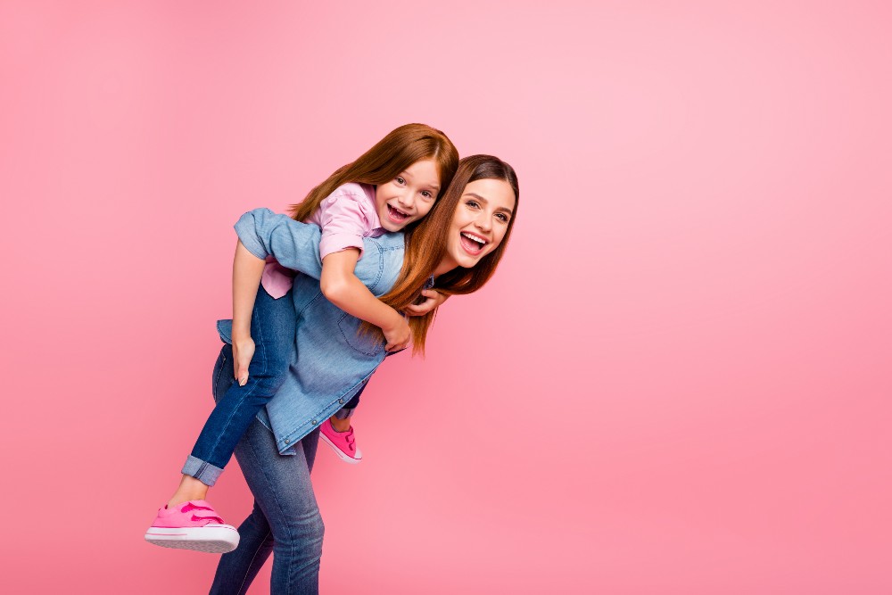 Mom and daughter happy after mommy makeover