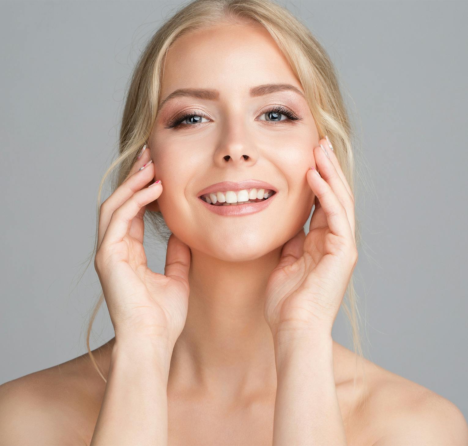 woman touching face with her hands