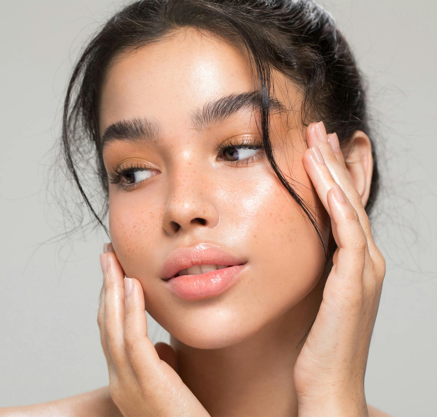 woman touching her face with her hands