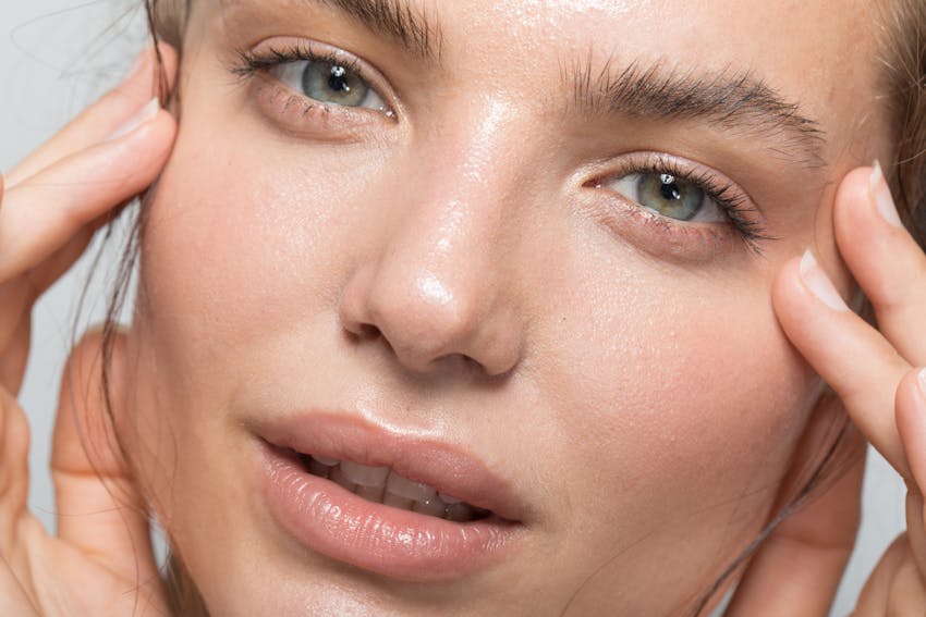 Woman with gorgeous skin looks peacefully at the camera in a studio shoot. Her perfect skin is to show to the potential results of ALASTIN in FOrt Lauderdale