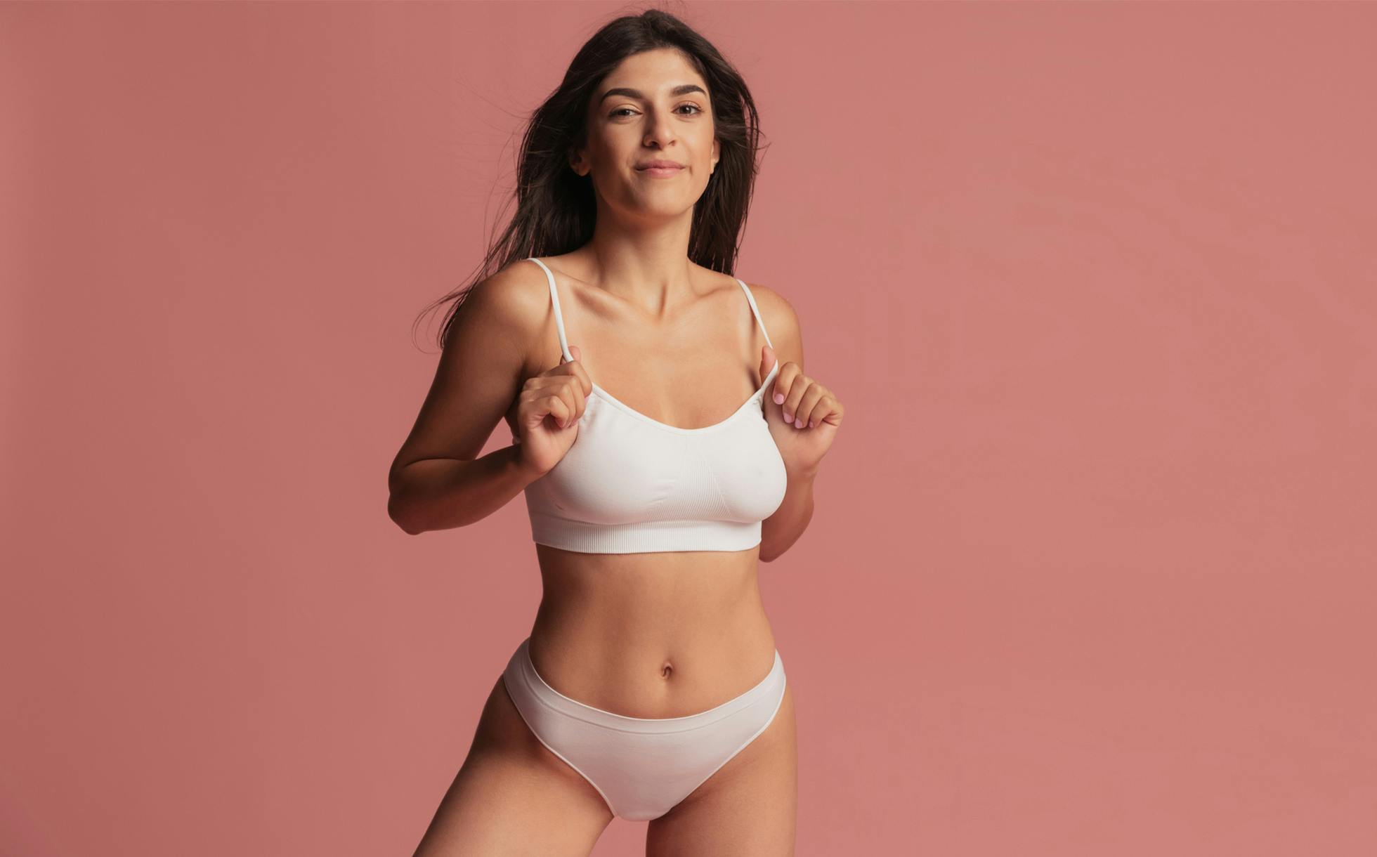 Model smiling in pajamas
