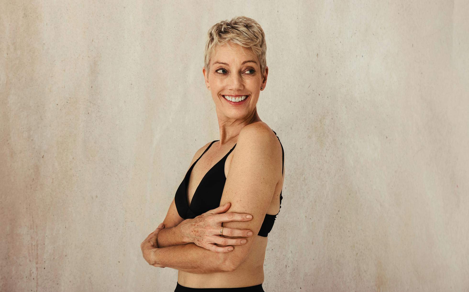 Woman smiling with hands on her hips