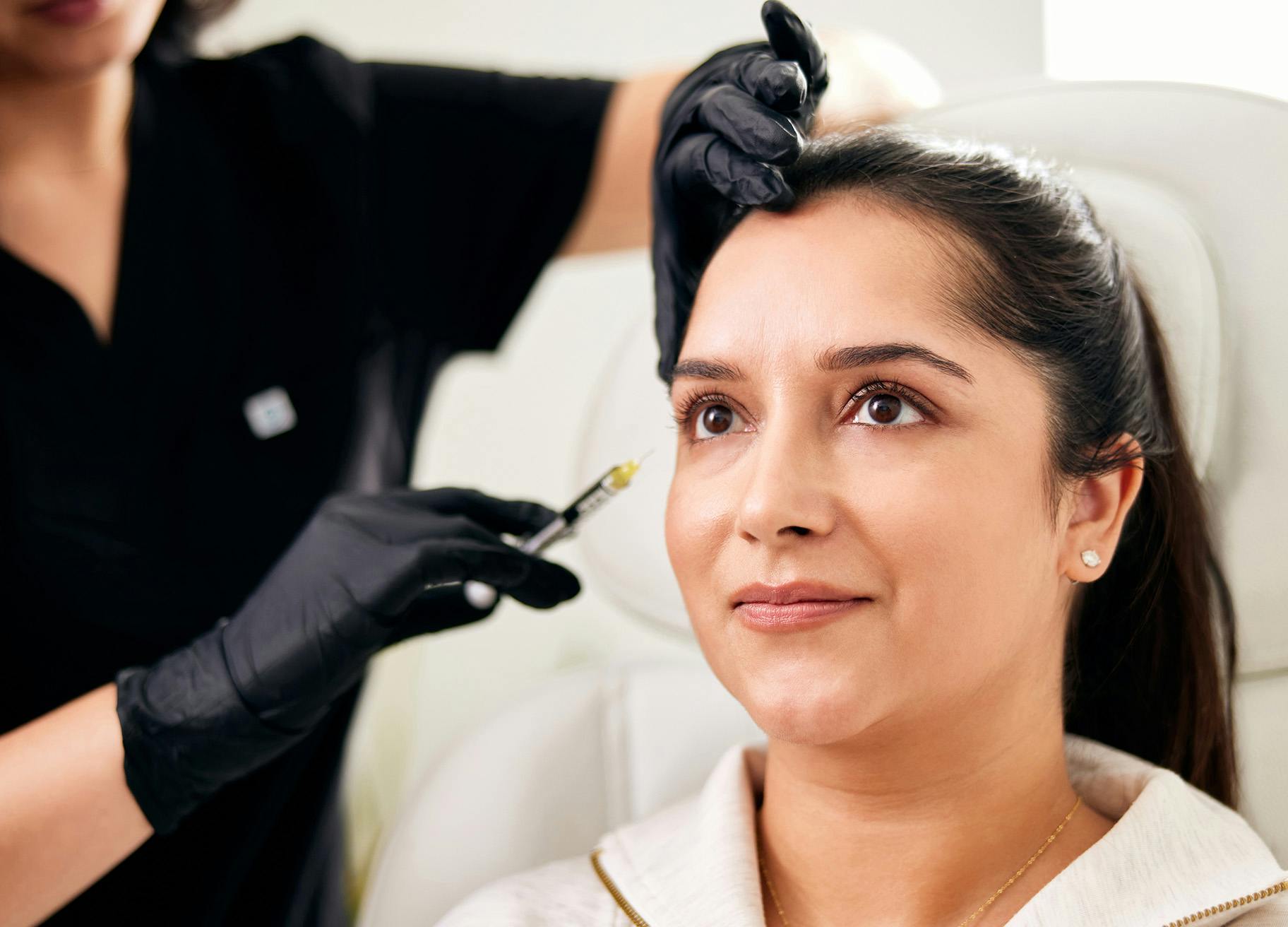 Woman getting injectable treatment