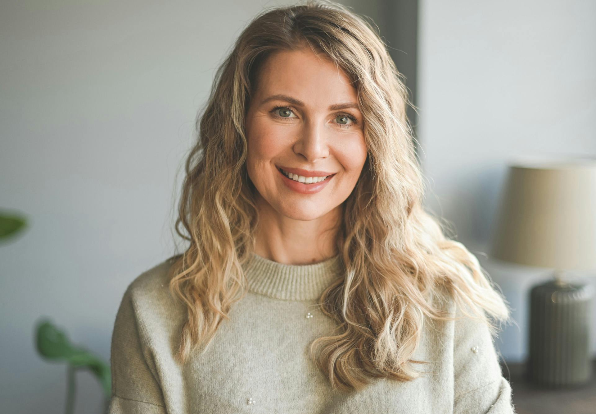 smiling in cashmere sweater