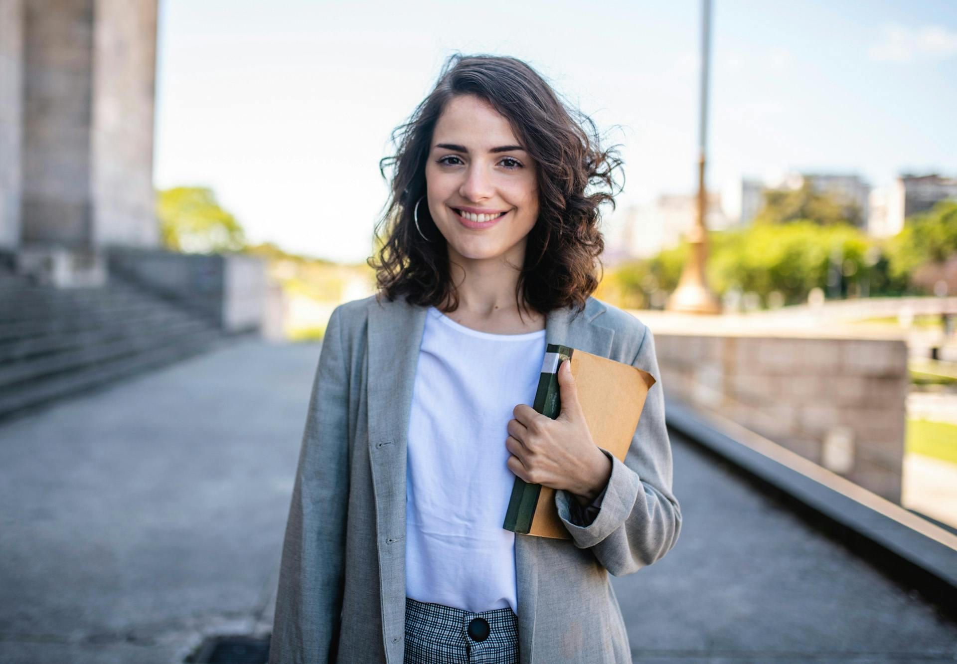 holding book business casual