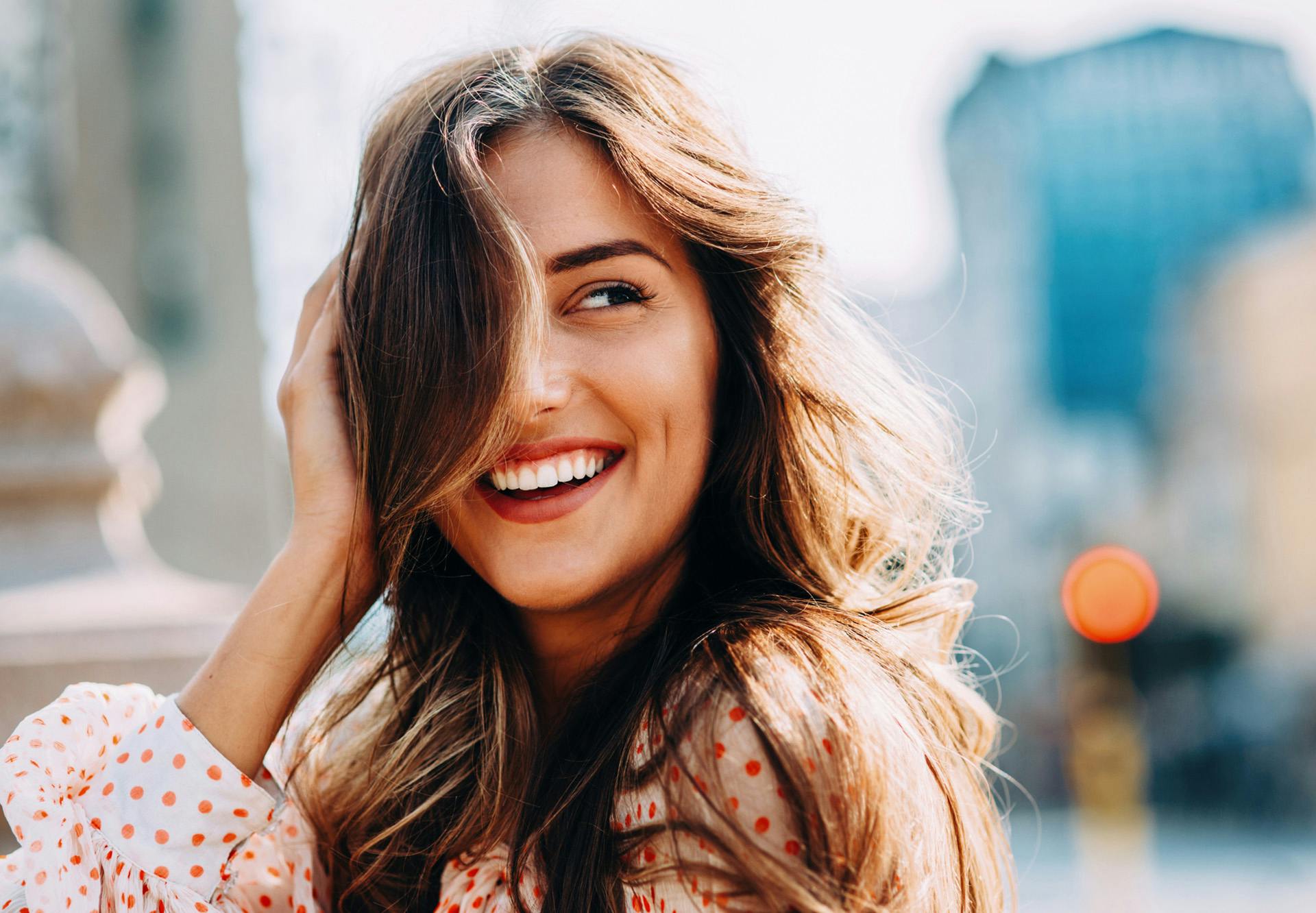 smiling with city in background
