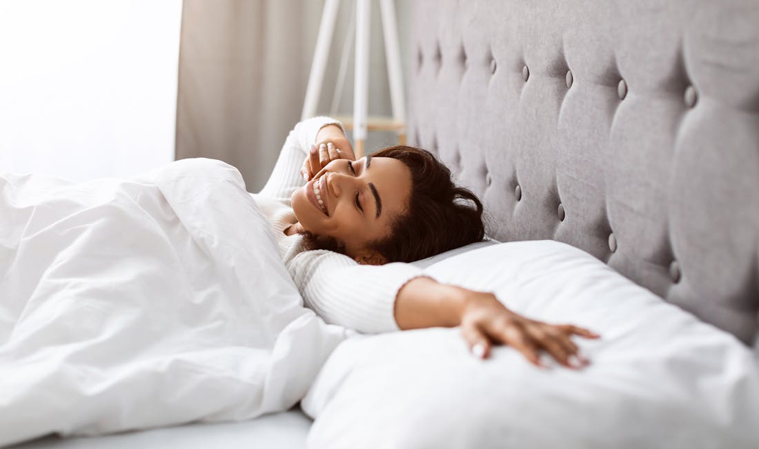 sprawling out in bed