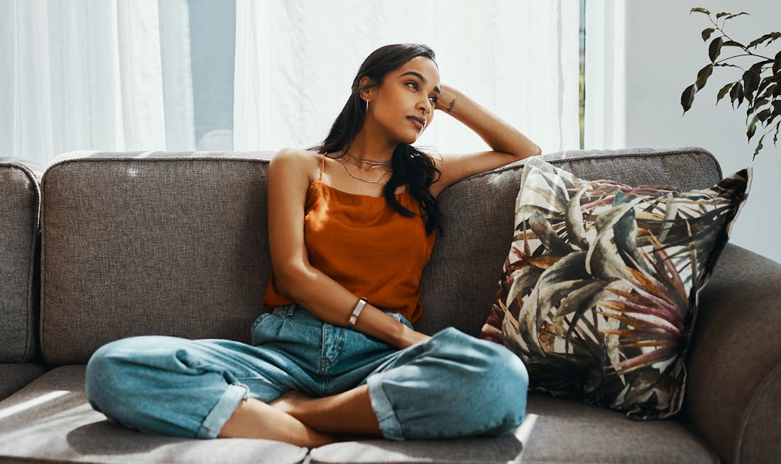 sitting lazily on couch