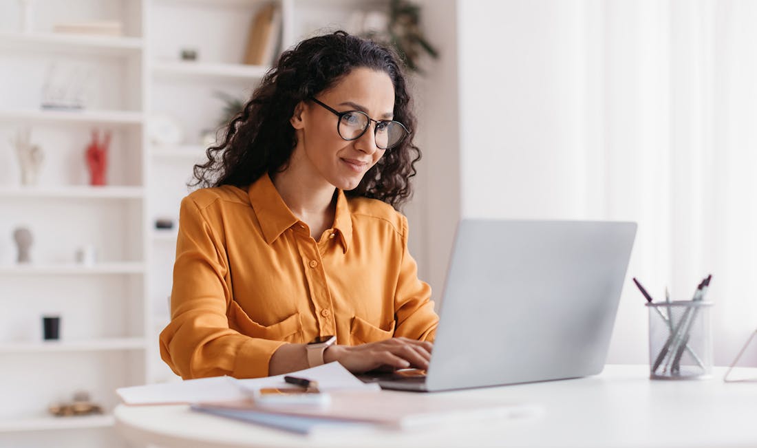 researching financial options on laptop