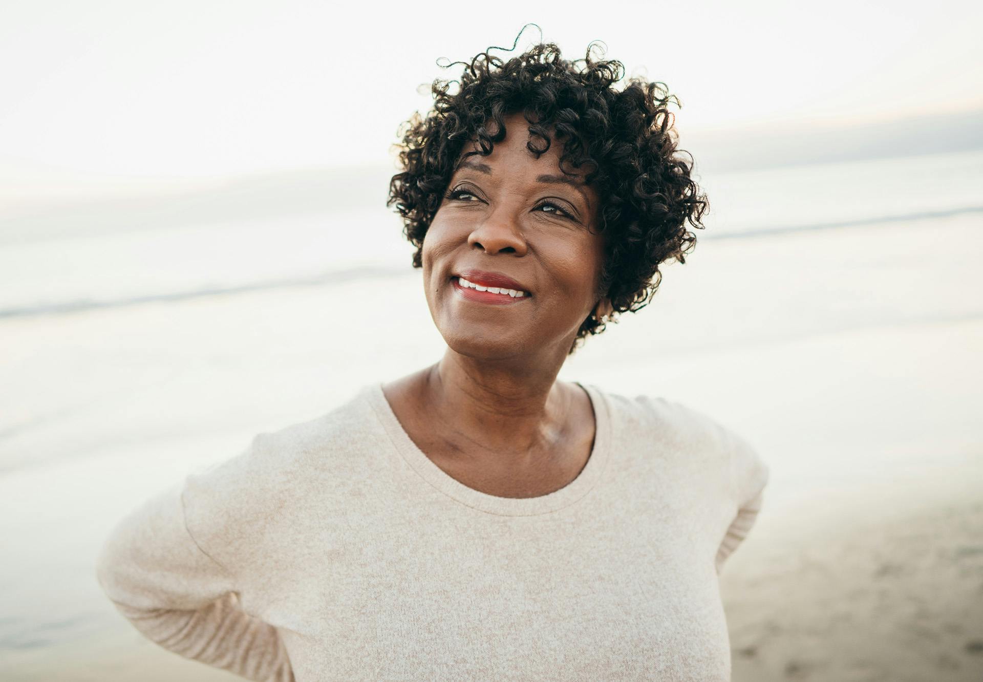 smiling in polka dot blouse