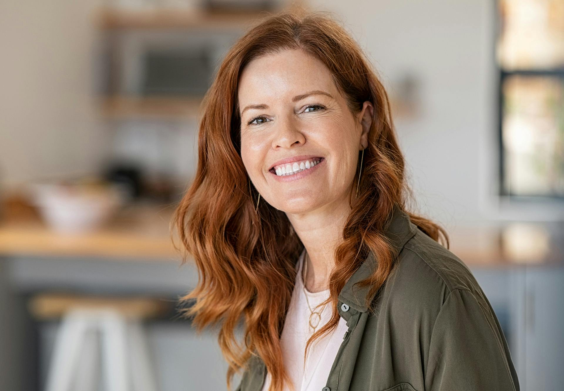 girl wearing denim jacket with ocean in background