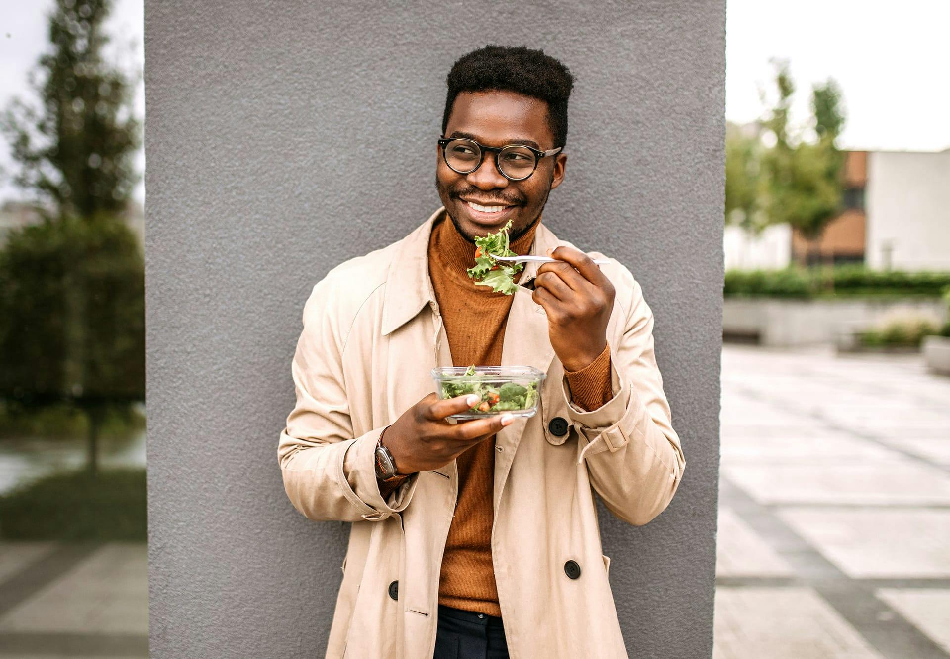 man eating a salad